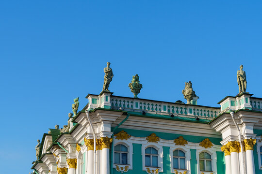 Sculptures and statues on parapet of roof of Hermitage Palace in St. Petersburg