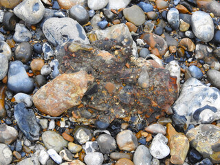 Old metal combined with stones by nature