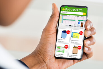 Woman Reading News On Mobile Phone