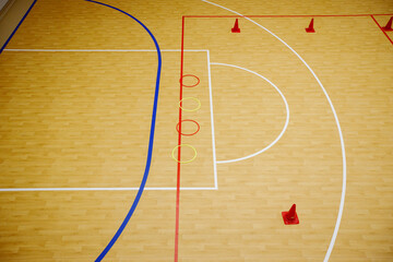 Gym for playing futsal, mini-football. Folded wooden parquet on the field of hall for...