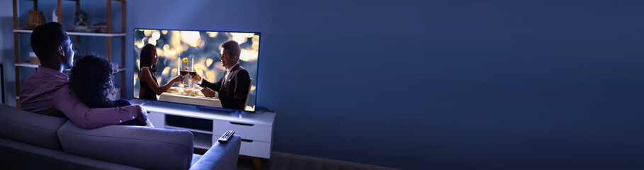 Affectionate Family Watching TV