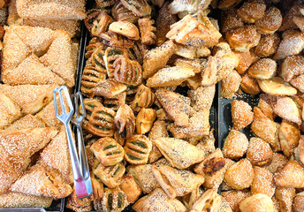 Sweet, delicious croissants favorite sweet for children and adults. Buns baked with different taste: poppy seeds, cinnamon, chocolate, fudge,  sugar and req. Dessert for tea, milk, coffee or chocolate