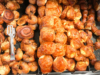 Sweet, delicious croissants favorite sweet for children and adults. Buns baked with different taste: poppy seeds, cinnamon, chocolate, fudge,  sugar and req. Dessert for tea, milk, coffee or chocolate