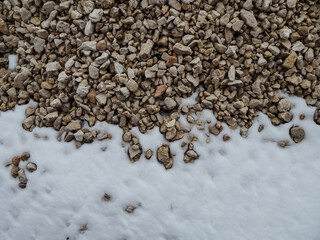 limestone stone lies in the snow