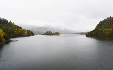 View of Colibita lake on a cloudy day, in Carpathian mountains in Romania, Transylvania, Bistrita Nasaud county.
