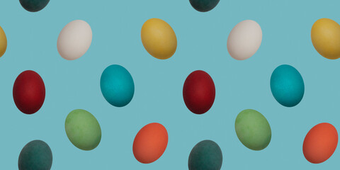Seamless repeating pattern. Colorful chicken boiled eggs on a blue background turned in different directions. The concept of Easter wallpaper for advertising, greeting cards and editing. 