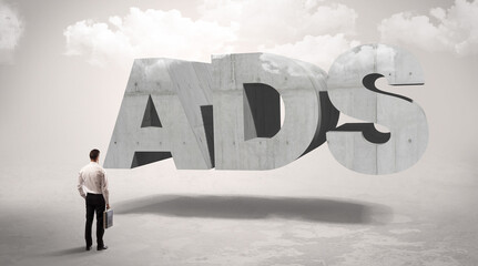 Rear view of a businessman standing in front abbreviation