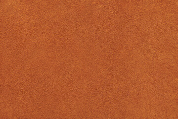 Fototapeta premium Surface of the brown calf chamois leather background texture. Top view. Close up.