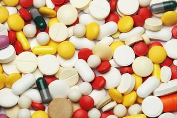 Different colorful tablets at white background