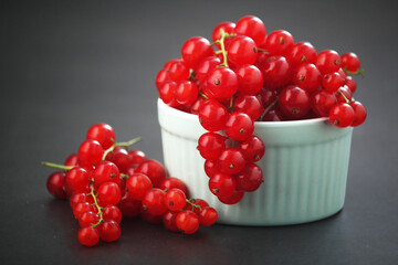 A ceramic bowl with red currant berries	
