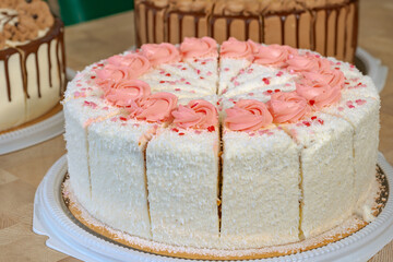 delicious sweet cake with butter cream on a table in a cafe