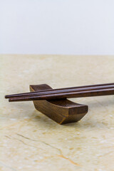 Pointed ends of wood chopsticks, close up.