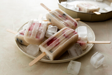 Fruit healthy berry ice cream. Homemade popsicle lolly with strawberries, blueberries and bananas.