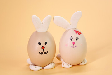 Funny Bunny Easter eggs isolated on beige color background