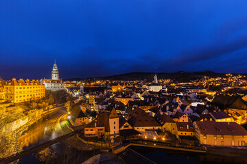 Aerial panorama night view of Český Krumlov old town with the Cesky Krumlov castle and tower in background and Vltava river flowing around, Czech Republic - 420152001