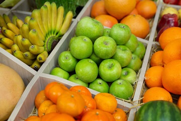 Fruits: orange, banana, apple, watermelon, grapes on the counter of the store.