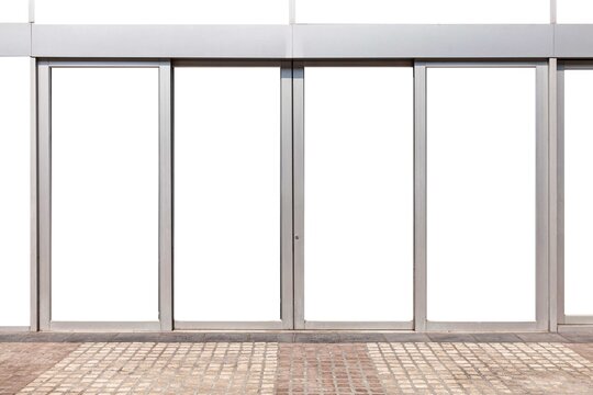 Large aluminum door frames and brown stone floor at the entrance to the building
