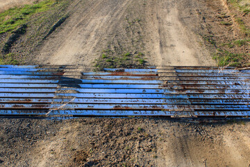 Cattle guard on dirt road
