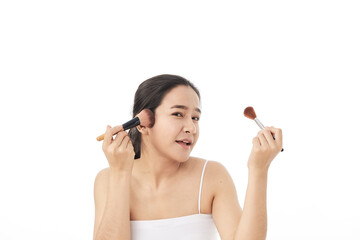 woman applying make up with a brush