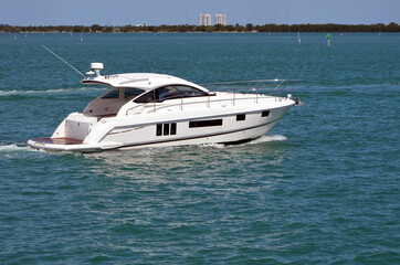 High end white cabin cruiser on the Florida Intra-Coastal Waterway off Miami Beach.