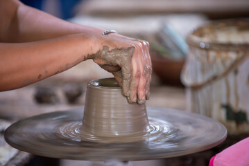 hands of a potter at work