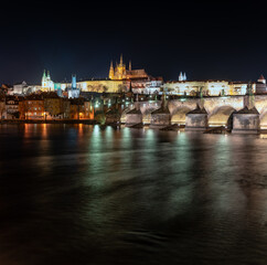 .view of the illuminated Prague Castle and the Cathedral of St. Vitus and Charles Bridge on the...