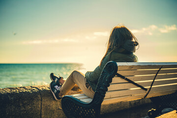 person sitting on the pier