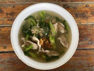 pork and vegetable soup on table