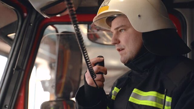 fire fighter on his duty doing his job and he is talking on the takiwaki