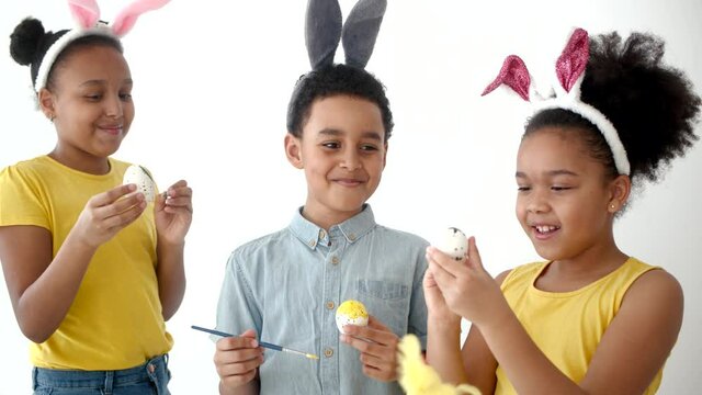 playing and coloring eggs for ester