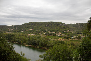 Fototapeta na wymiar Ardeche river with village in background - France