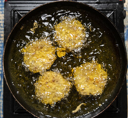 Frying mung bean fritters or locally known as 