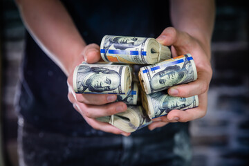closeup holding thousands of U.S. dollars
