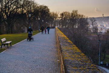 Fototapeta premium .pedestrians on the sidewalk at Vysehrad in a park in the center of Prague in lockdown 2021