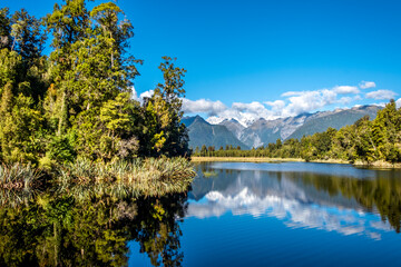 Naklejka na ściany i meble The Southern Alps reflecting in Matheson Lake. South Island, New Zealand.