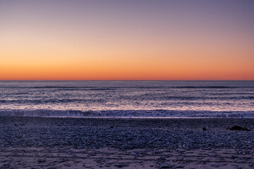 Fototapeta premium Ocean beach at sunset. South Island, New Zealand.
