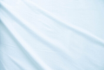 Fabric texture with light waves. A sheet of delicate color.