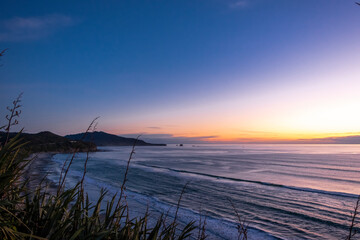 Sunset on a remote beach. South Island, New Zealand.