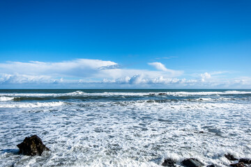 Ocean surf on a remote beach. South Island, New Zealand.