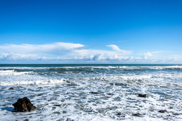 Ocean surf on a remote beach. South Island, New Zealand.