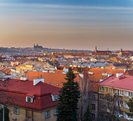 Obraz premium panoramic view of the city of Prague and the sights of Prague Castle and the Church of St. Vitus at sunset, 2021