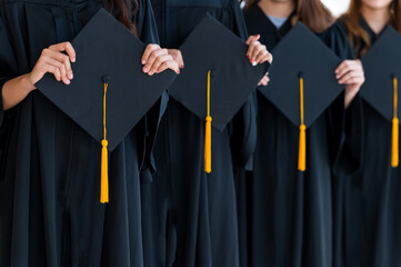 Fototapeta Close up group of graduates holding a hat At the graduation ceremony at the university obraz