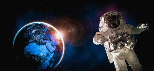 Astronaut spaceman do spacewalk while working for space station in outer space . Astronaut wear full spacesuit for space operation . Elements of this image furnished by NASA space astronaut photos. © InfiniteFlow