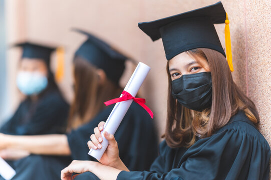 The Class Of 2021,group Of Graduates Asian Student Wear A Mask At A Distance At The Graduation Ceremony At The University