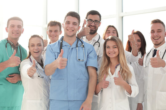 close up. young medical professionals showing thumbs up - Powered by Adobe