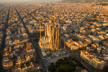 Aerial drone shot of Barcelona city center in Sunrise golden hour during Spain winter