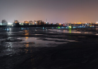 frozen river, night and ice anglers