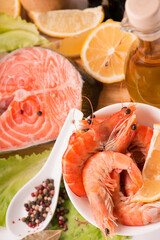 Fresh salmon steak filet, ginger, lemon, soy sause and chopsticks