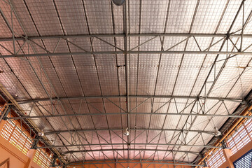 Steel roof structure. Moonlight bulb. Steel structure with roof tiles. Architectural structure of roof. Large roof layout used for industrial plants.