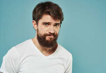 Portrait cropped view of male bushy beard brunette model